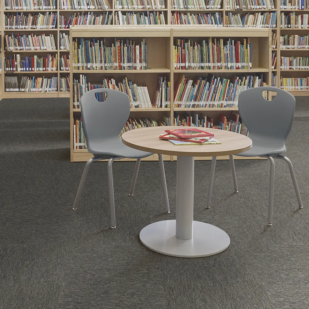 Commercial carpet in library with bookshelves and sitting area